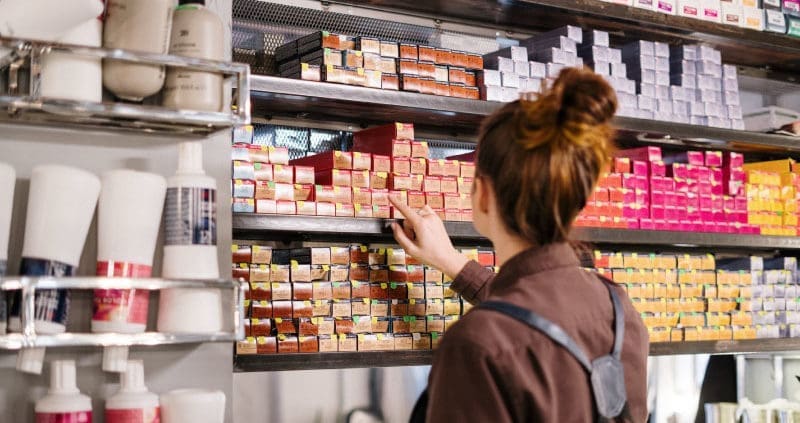 a hairstylist picking out color mixes