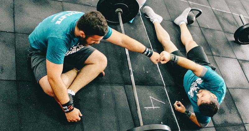 two people sitting at a gym