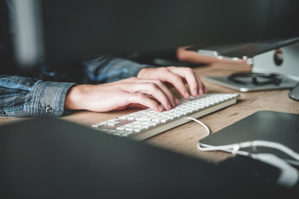 A person works on their laptop.