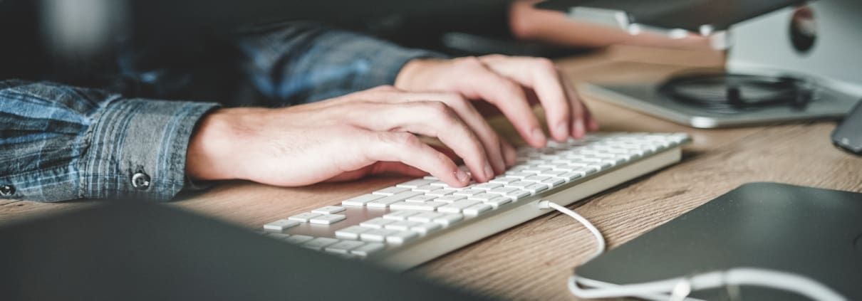 A person works on their laptop.