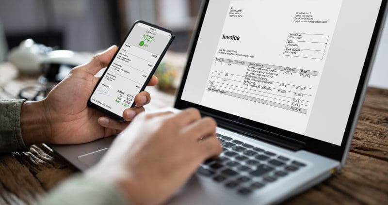a person verifying invoices on a computer