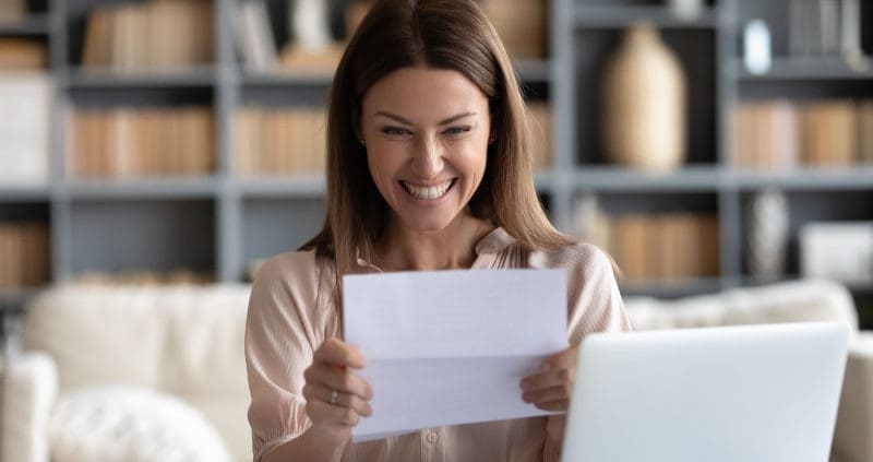 a person looking at a paper