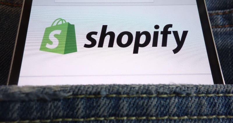 a phone with shopify logo