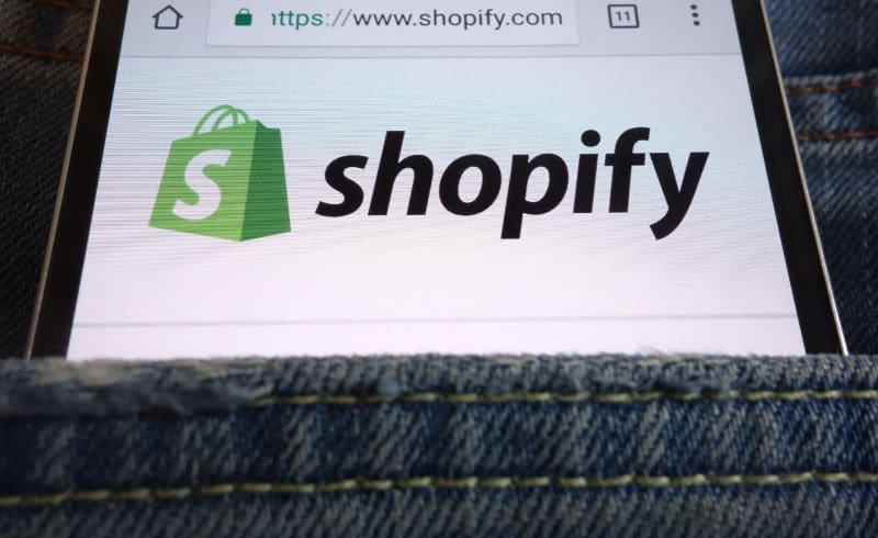a phone with shopify logo