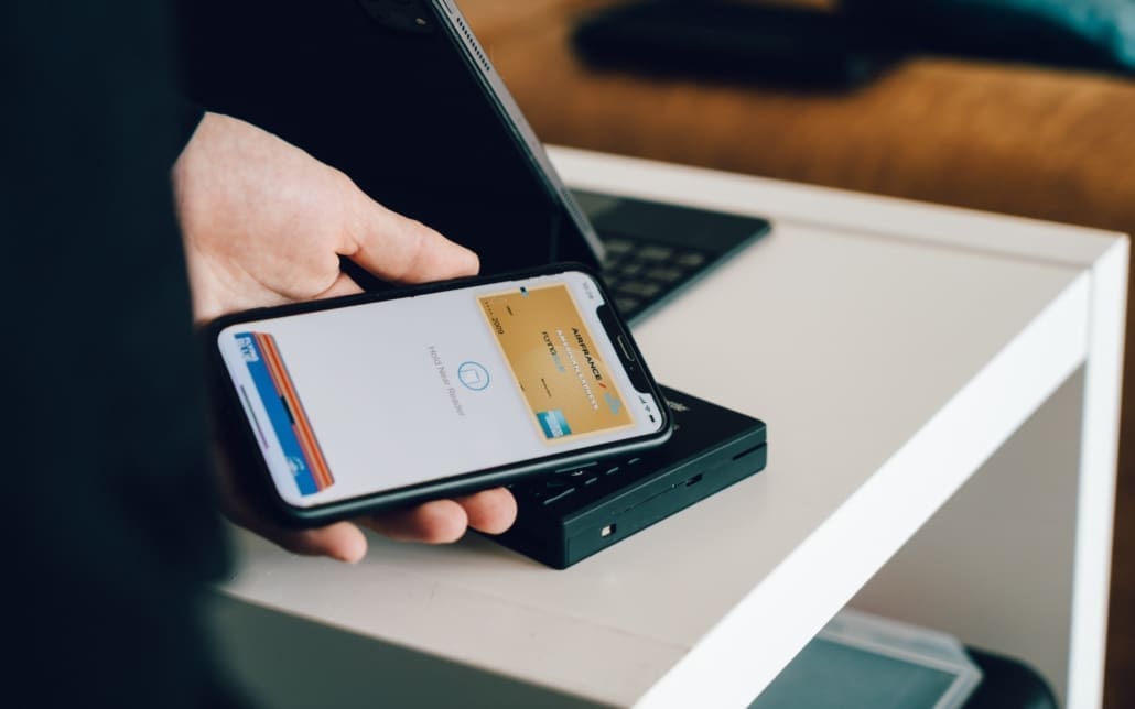 A man pays for an item using his digital wallet on his phone