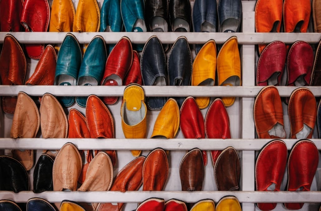 An array of different color shoes are lined up for an inventory check.