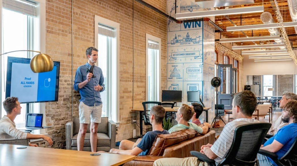A small business team discusses changing from an LLC to an S Corp