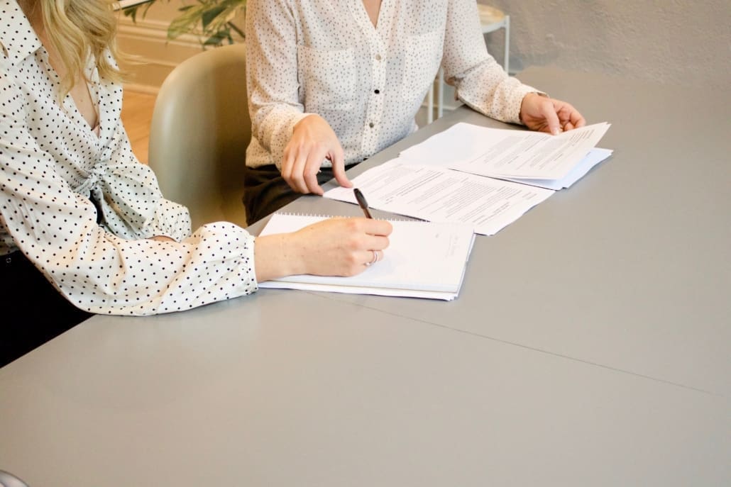 Two business women discuss Florida tax laws