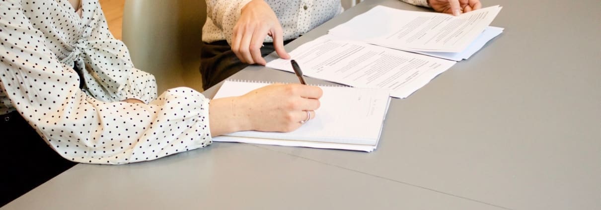 Two business women discuss Florida tax laws