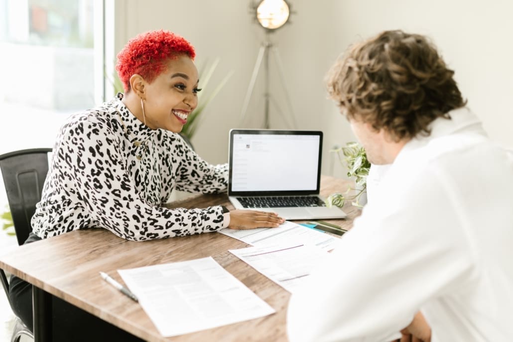 A bookkeeper shows a business owner how to set up an invoice