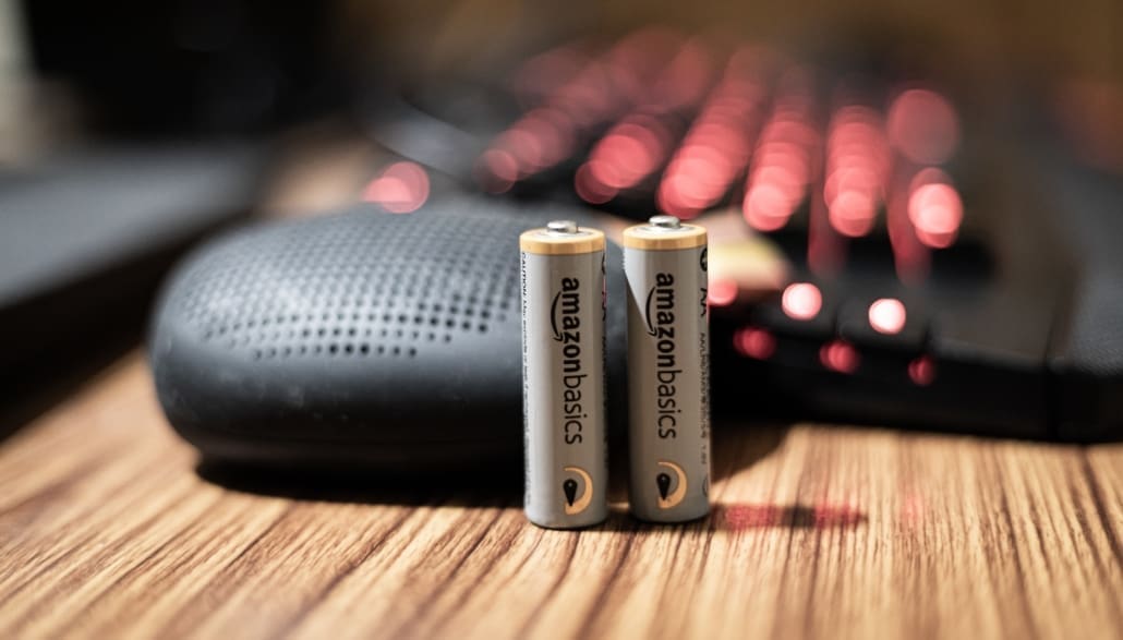 Closeup of two Amazon labeled AA batteries.