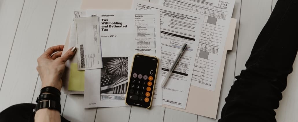 a person looking at tax papers