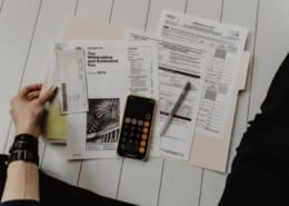 a person looking at tax papers