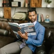 a man reading a book about financial planning