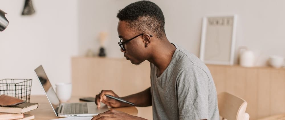 a person sitting at a desk looking at their chart of accounts