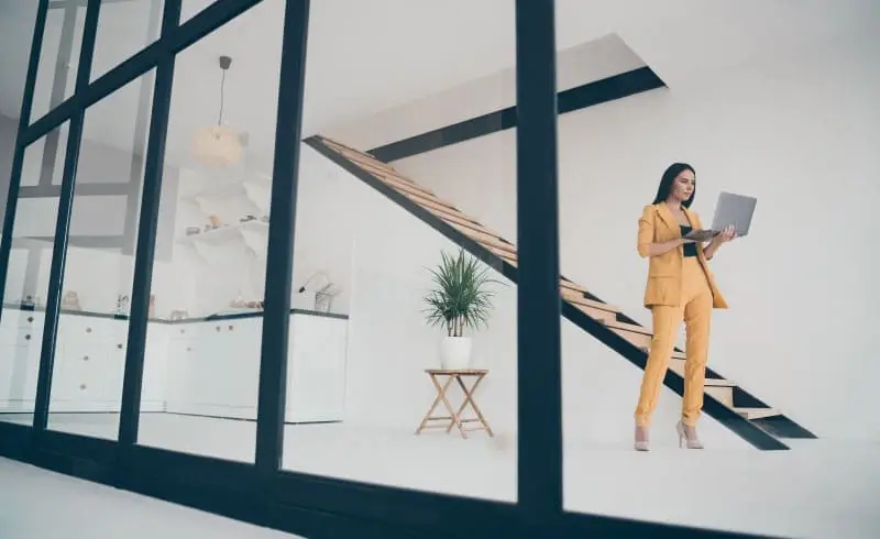 |A person works on their laptop.