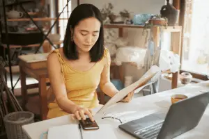 ||Small business woman doing accounting||