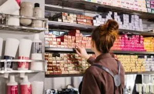 a hairstylist picking out color mixes