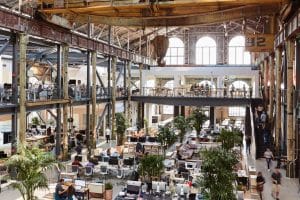 A large warehouse that is converted into an office space