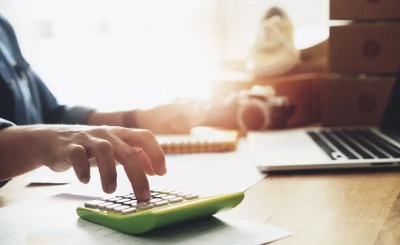 a person using a calculator