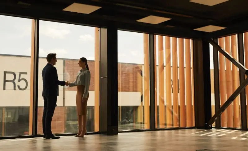 a man and woman shaking hands