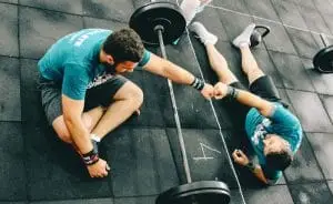 two people sitting at a gym