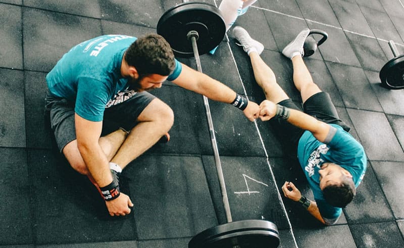 two people sitting at a gym
