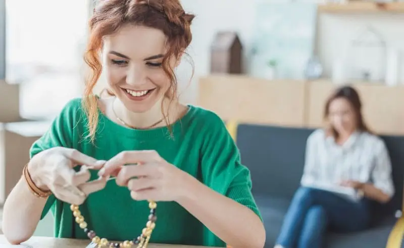 a jewelry shop owner with a necklace