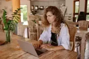 A woman looking at a laptop