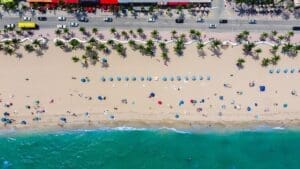 an aerial view of a beach|A man and a sketch out a project for their LLC business