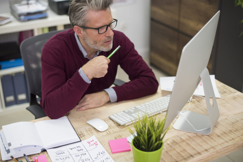 Business Owner Reviewing Mid Year